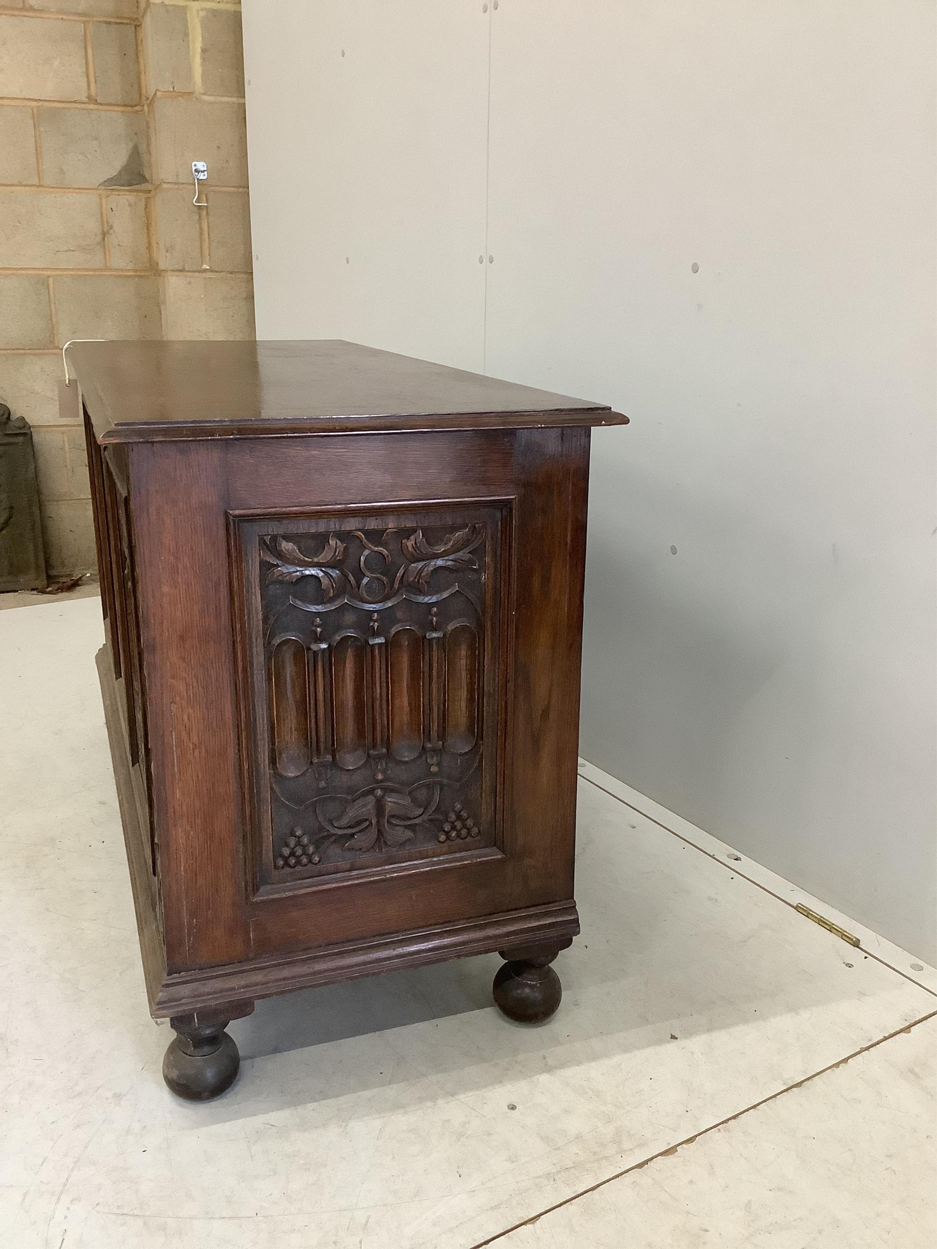 A 17th century style carved oak coffer, width 121cm, depth 52cm, height 76cm. Condition - fair